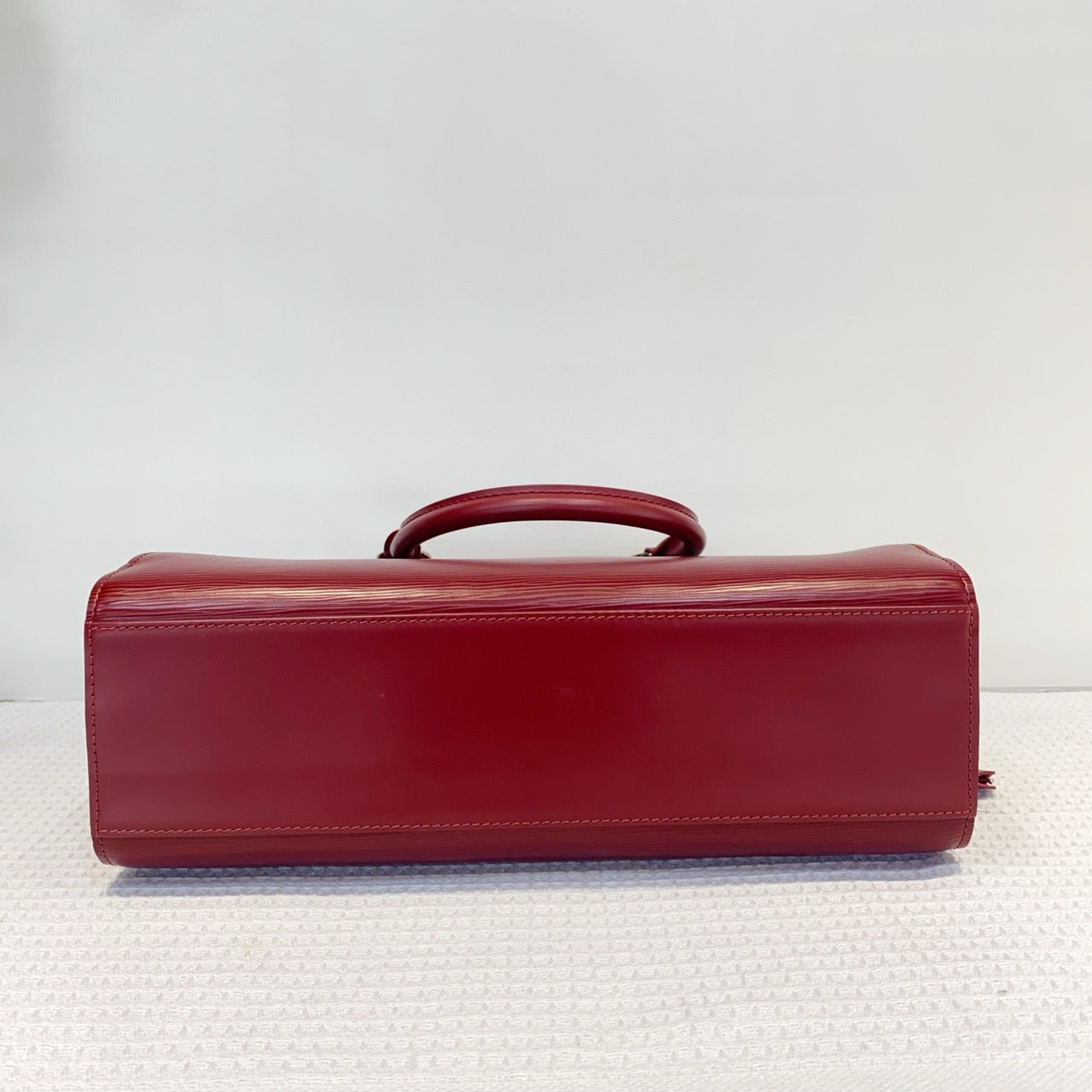 Louis Vuitton red water ripple handbag