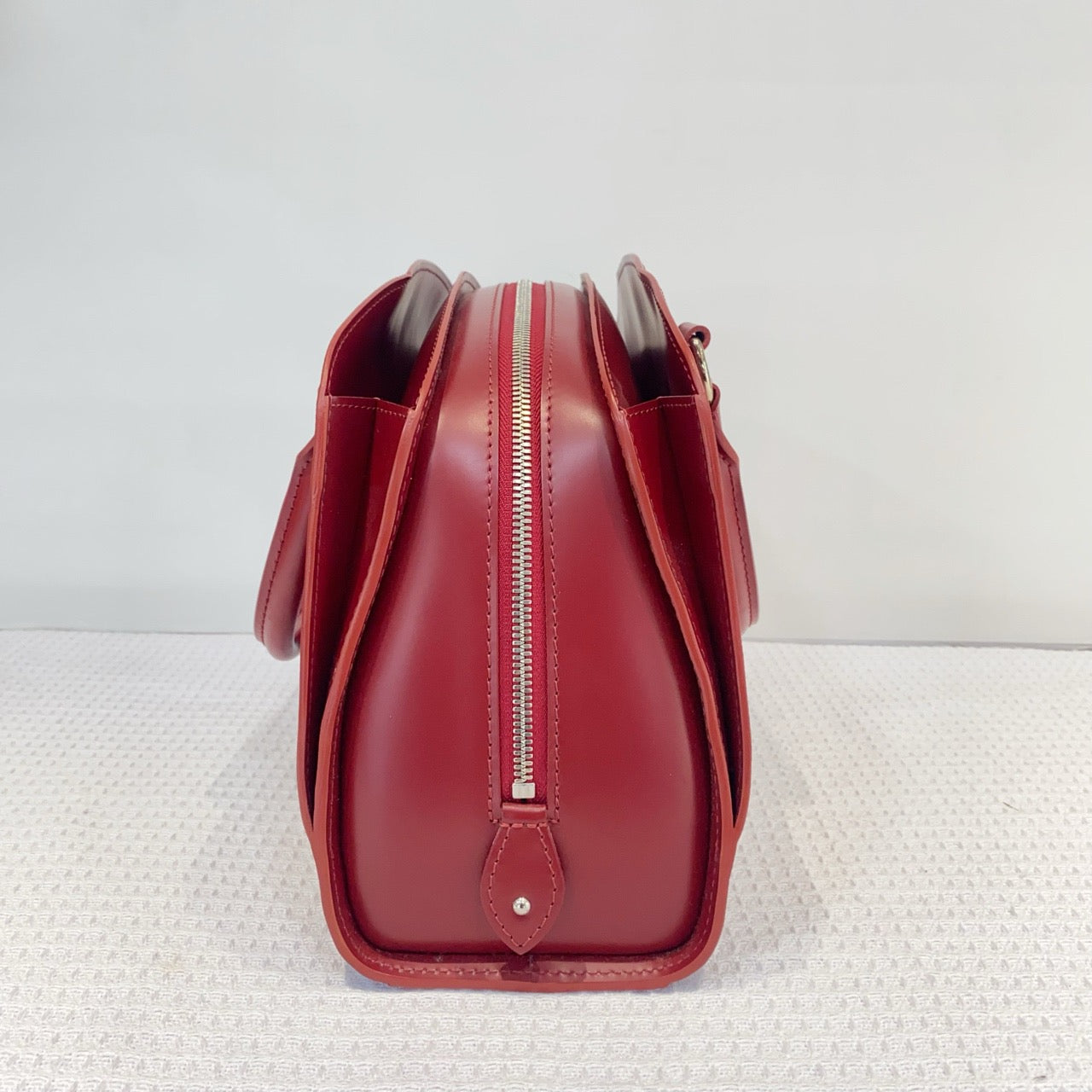 Louis Vuitton red water ripple handbag