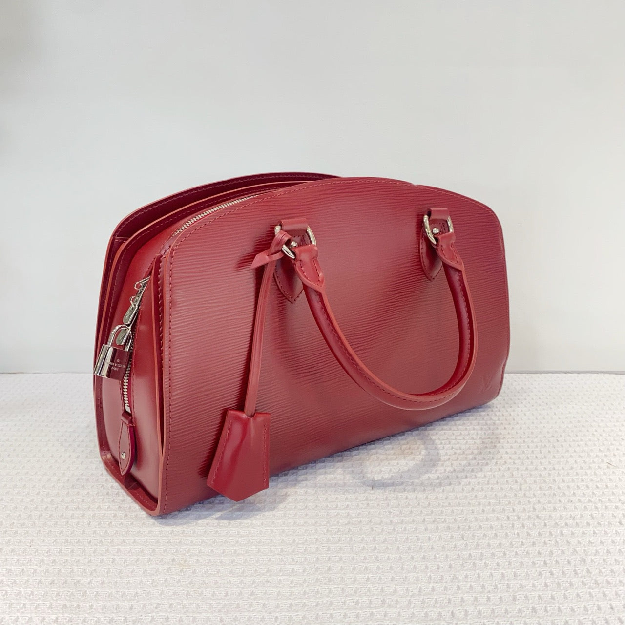 Louis Vuitton red water ripple handbag