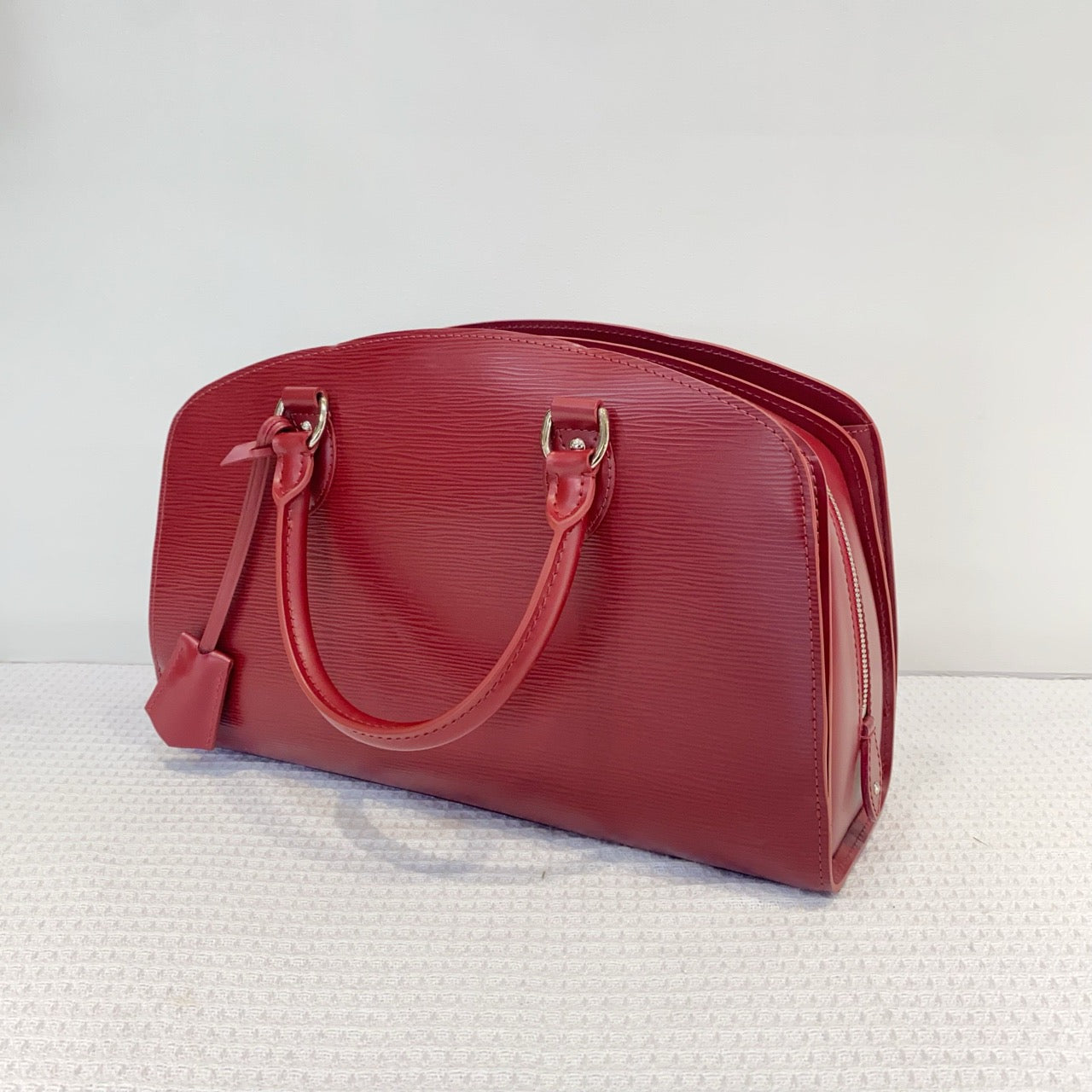 Louis Vuitton red water ripple handbag