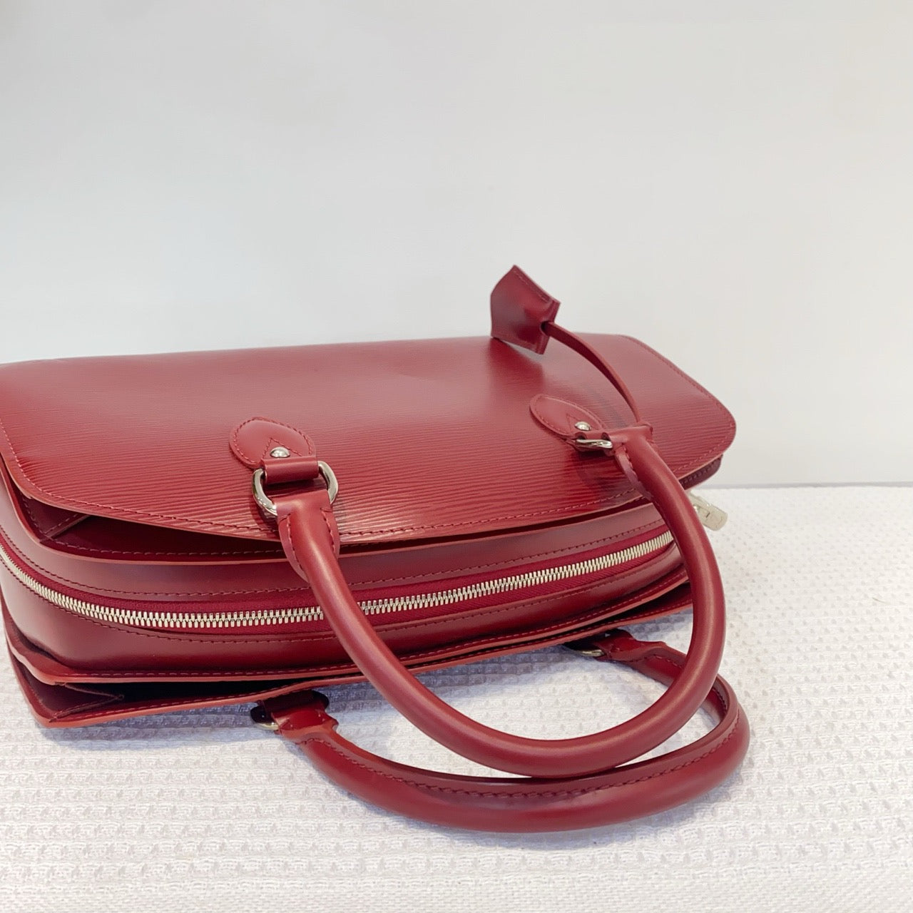 Louis Vuitton red water ripple handbag